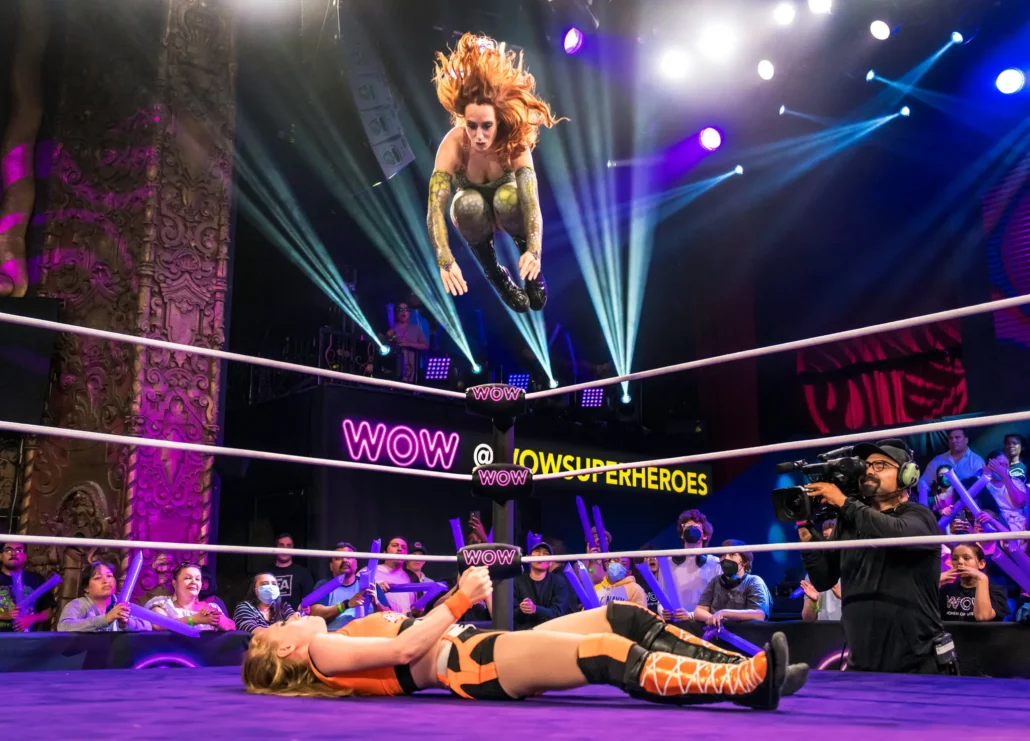 Ms. Buss saw female empowerment when she first went to a WOW show. Here, Princess Aussie jumps from the top rope onto BK Rhythm at a recent taping of WOW in Los Angeles.Credit...WOW Television Enterprises, LLC